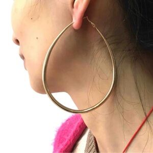 A pair of sleek, gold hoop earrings, perfect for any occasion